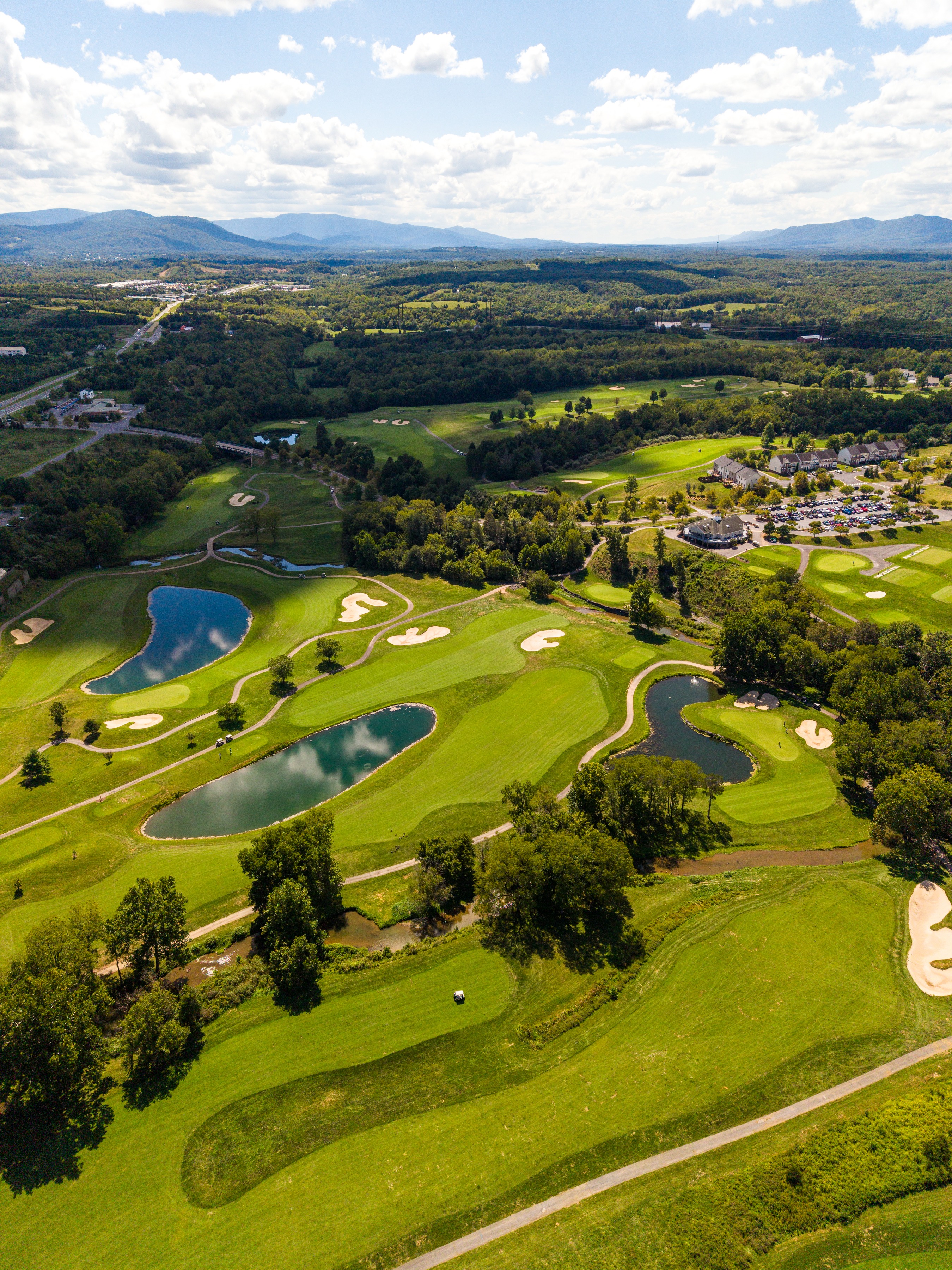 Aerial photograph of a golf course in a sweeping valley